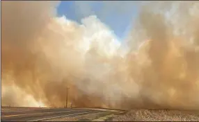  ?? (AP/Nebraska State Patrol) ?? Smoke billows from a wildfire Saturday near Cambridge, Neb.