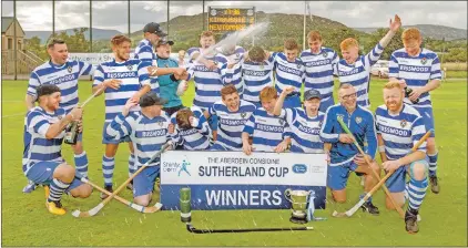  ?? Photo: Neil Paterson ?? Celebratio­ns begin for Newtonmore after they defeated Badenoch rivals Kingussie 5-2 in the final of the Aberdein Considine Sutherland Cup.