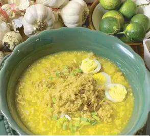  ?? ?? With various toppings and a vibrant orange color, this congee is like lugaw with an attitude