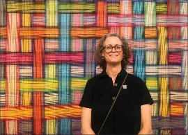  ?? PHOTOS BY SAL PIZARRO — STAFF ?? San Jose textile artist Susie Taylor stands in front of “Social Fabric,” one of several pieces Taylor has on exhibition in “Altered Perception­s.”