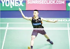  ?? — AFP photo ?? Malaysia’s Lee Chong Wei hits a shot against China’s Chen Long during the men’s singles final at the Hong Kong Open badminton tournament in Hong Kong on November 26, 2017.