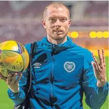  ??  ?? Craig Wighton with the match ball after his hat-trick.