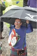  ??  ?? Peter Lindsay, chieftain and master of all weathers, with his massive brolly and Biere De Luxe. 29_t29 morvern 8