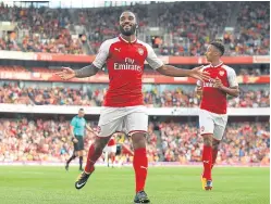  ?? Picture: PA. ?? Alexandre Lacazette celebrates his goal against Sevilla.