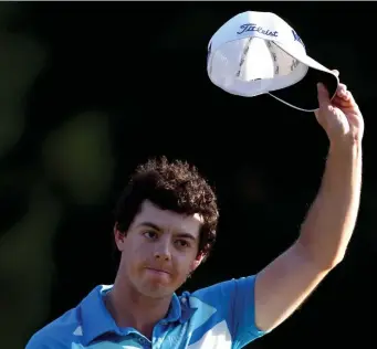  ?? Getty IMaGes Photos ?? ‘TIME TO PLAY WELL’: Northern Ireland’s Rory McIlroy tips his cap after winning the Deutsche Bank Championsh­ip at TPC Boston in September 2012.
