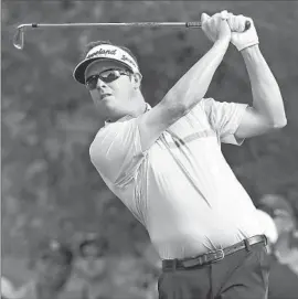  ?? Stephen Dunn Getty Images ?? CHARLIE BEL JAN, who shot 68 Saturday, can chew up a golf course but sometimes forgets to eat, which helped fuel his anxiety attack at a tournament last year.