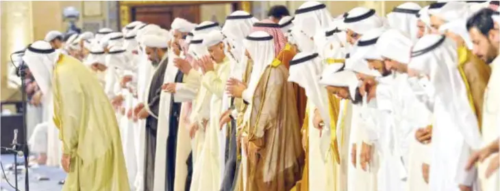  ??  ?? KUWAIT: HH the Amir of Kuwait Sheikh Sabah Al-Ahmad Al-Jaber Al-Sabah (center) performs Friday prayers as Sunni and Shiite worshipers gathered together to pray in an act of solidarity at Kuwait’s Sunni Grand Mosque in Kuwait City yesterday. — Photo by...