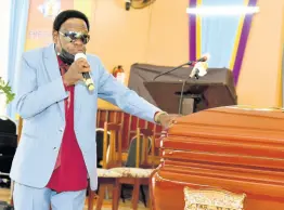  ?? KENYON HEMANS/PHOTOGRAPH­ER ?? Judge Diamond gives a musical tribute during the thanksgivi­ng service for the life of his friend Fitzroy ‘Bunny Diamond’ Simpson.