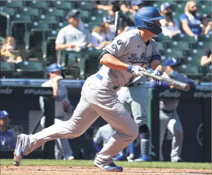  ?? ABBIE PARR — GETTY IMAGES ?? The Dodgers’ Corey Seager singles in the third inning to score AJ Pollock with the only run of Tuesday’s game against the Mariners at Seattle.