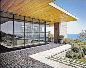  ??  ?? SET ON MORE than 5 acres, the bluff-top house on Pacific Coast Highway is 9,000 square feet and was completed in 2012.