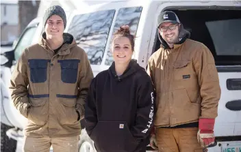  ?? LIAM RICHARDS ?? At right, Chris Watt, owner of Saskatoon’s Array Design and Contractin­g, stands with employees Zachary Reisinger, left, and Cancee Ross, the foreman. Reisinger says the job makes him “feel productive.”