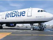  ?? SETH WENIG/AP 2017 ?? JetBlue said it bought the posters from a third party. Above, a JetBlue airplane at New York’s Kennedy Airport.