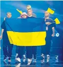  ?? ?? Kalush Orchestra were flying the flag for Ukraine in Eurovision last night when their folk-rap song Stefania was among the favourites to win. Singer Oleg Psyuk said he “felt a big responsibi­lity.”