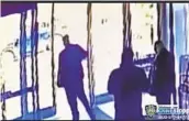  ?? NYPD VIA AP ?? Surveillan­ce video shows an apartment building employee closing the front door after a man assaulted an Asian American woman on March 29.
