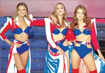  ?? AFP ?? Miss Normandie Amandine Petit (left) and Miss Provence April Benayoum (centre) compete on stage during the Miss France 2021 beauty contest on December 20.