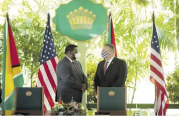  ?? (Photo: AFP) ?? US Secretary of State Mike Pompeo (right) speaks with Guyana’s President Mohamed Irfaan Ali during a joint press conference in Georgetown on September 18, 2020.