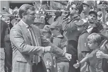  ?? STAFF PHOTO BY C.B. SCHMELTER ?? Georgia football coach Kirby Smart greets fans before a home game against Tennessee on Sept. 29. Smart received a new contract this spring after just two seasons leading the Bulldogs.