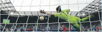  ??  ?? Argentina goalkeeper Vanina Correa, front, saves a penalty kick by England’s Nikita Parris during the Women’s World Cup Group D soccer match between England and Argentina .