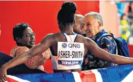 ??  ?? That’s my girl: Dina Asher-smith with mother Julie and coach John Blackie after winning the 200m world title