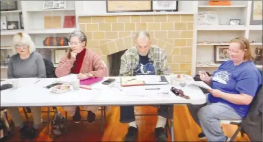  ?? Westside Eagle Observer/SUSAN HOLLAND ?? Officers of the Friends of the Gravette Public Library preside at the group’s quarterly membership meeting Tuesday evening, Nov. 15, at the Gravette Community Room. Pictured are FOGPL treasurer Carole Robel, vice-president Melinda Crawley, president Roy Perrine and secretary Teresa Davis.