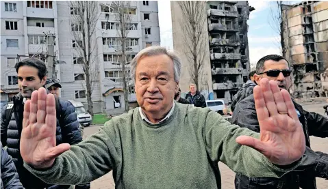  ?? | AFP ?? UN SECRETARY-General Antonio Guterres gestures as he visits Borodianka, outside Kyiv, yesterday, where Russian forces were accused of having killed civilians. Guterres said that innocent civilians were paying the highest price for a war.