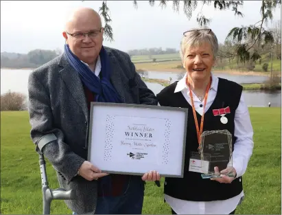  ?? ?? Tom Hunter, MS Society National Council, presenting Siobhan Allister, BEM with her Volunteer Impact of the Year award at a recent MS Society lunch at the Killyhevli­n Hotel. Photos by Trevor Armstrong.