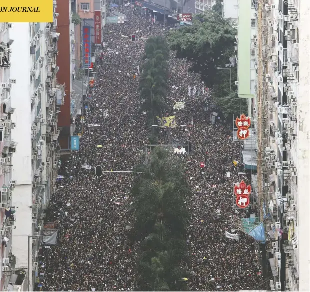  ?? TyroneSiu/ Reuters ?? Protesters attend a demonstrat­ion demanding Hong Kong’s leaders to step down and withdraw an extraditio­n bill last month. An expert says protesters are also angry at the neglect of other civil liberties, including the right to a dignified standard of living.