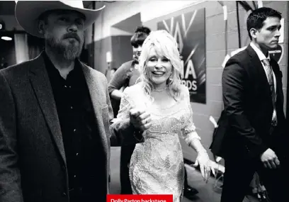  ??  ?? Dolly Parton backstage at the 53rd annual CMA Awards in Nashville in 2019; performing on The
in 2018.