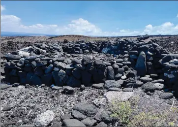  ?? (AP/National Park Service) ?? Stone walls of a former coastal dwelling are shown at Pohue Bay.