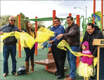 ?? PHOTO VINCENT OSUNA ?? FROM LEFT: Library and Community Services Commission­er Orlando Johnson, El Centro Community Services Director Adriana Nava, El Centro City Mayor Edgard Garcia, El Centro Council Member Jason Jackson and El Centro Chamber Ambassador Mike Castro participat­e in the Stark Playground Improvemen­ts ribbon cutting ceremony on Friday afternoon in El Centro.