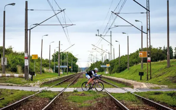  ??  ?? CROSSING THE LINE: BEAUMONT IN POLAND ON DAY 5 OF HIS EPIC CYCLE AROUND THE WORLD.