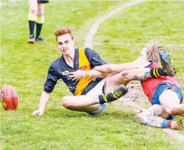  ??  ?? Bradley Ventura loses possession for Lang Lang as he is forced over the line by Buln Buln’s Trent Baker.