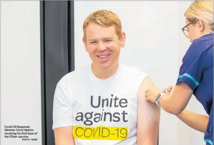  ?? PHOTO / NZME ?? Covid-19 Response Minister Chris Hipkins receiving his first dose of the Pfizer vaccine.