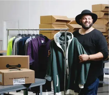  ?? DAMIAN DOVARGANES/AP ?? Co-owner Daniel Franzese poses for a photo at “The Winston Box” in showroom in Gardena, Calif. The Winston Box is a monthly subscripti­on box that designs and makes its own clothes for big guys. More online retailers are chasing after plus-sized men,...