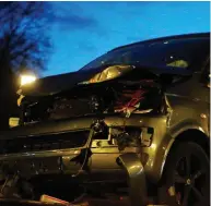  ??  ?? The damaged van used in the killings is removed from the scene. Right: A police officer takes away evidence found at an apartment owned by suspect Jens R in Muenster