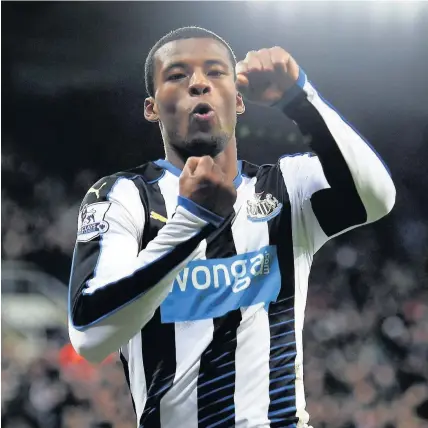  ??  ?? > Georginio Wijnaldum celebrates after scoring Newcastle’s second goal against Liverpool yesterday