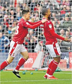  ??  ?? Plenty to shout about: Lewis Grabban (right) and Joe Lolley celebrate Forest’s winner