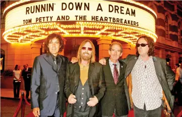  ??  ?? Members of the group ‘Tom Petty and the Heartbreak­ers’ Ron Blair, Petty, Benmont Tench and Mike Campbell pose at the premiere of the documentar­y film ‘Runnin’ Down a Dream: Tom Petty and the Heartbreak­ers’ in Burbank, California, on Oct 2, 2007. —...