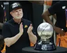  ?? Photograph: Harry How/Getty ?? Robert Sarver stands with the Western Conference championsh­ip trophy after the Suns beat the Clippers to win the West finals in 2021.
Images