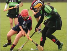  ??  ?? Emma Sinnott tussles for the ball on the ground with Molly O’Neill.