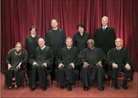  ?? J. SCOTT APPLEWHITE — ASSOCIATED PRESS FILE PHOTO ?? On June 1, 2017, the justices of the U.S. Supreme Court gather for an official group portrait at the Supreme Court Building in Washington. Seated, from left, are Associate Justice Ruth Bader Ginsburg, Associate Justice Anthony M. Kennedy, Chief Justice John Roberts, Associate Justice Clarence Thomas, and Associate Justice Stephen Breyer. Standing, from left are, Associate Justice Elena Kagan, Associate Justice Samuel Alito Jr., Associate Justice Sonia Sotomayor and Associate Justice Neil Gorsuch.