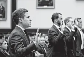  ?? Andrew Harrer / Bloomberg ?? Google’s Adam Cohen, from left, Facebook’s Matt Perault, Amazon’s Nate Sutton and Apple’s Kyle Andeer take the oath before a hearing of the House Judiciary subcommitt­ee on antitrust. Big Tech is facing a host of questions on dominance.