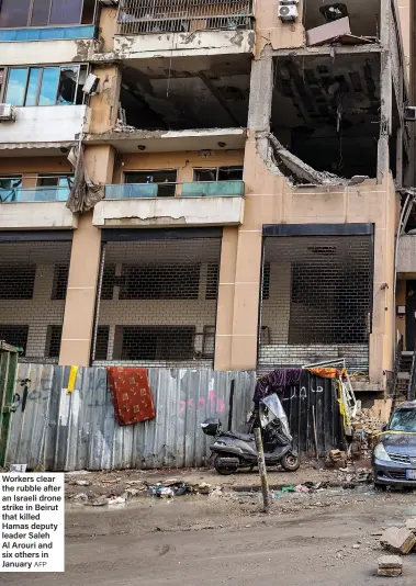  ?? AFP ?? Workers clear the rubble after an Israeli drone strike in Beirut that killed Hamas deputy leader Saleh Al Arouri and six others in January