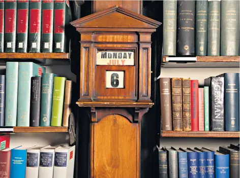  ??  ?? Next chapter: the clock in the reading room at the London Library, above, has been set to tomorrow’s date, when it will reopen with Covid-19 measures in place, below