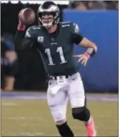  ?? JULIO CORTEZ — THE ASSOCIATED PRESS ?? Seeing more of this — Eagles quarterbac­k Carson Wentz getting outside the pocket — could be the sign that the signal-caller is all the way back from last year’s knee injury.