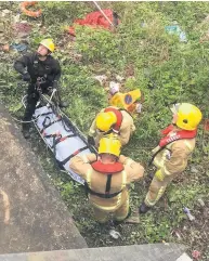  ??  ?? Delicate operation The young woman had fallen 20ft and needed to be rescued