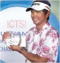  ??  ?? Mars Pucay holds the championsh­ip trophy after winning the ICTSI Players Championsh­ip at Southlinks Golf Club in Las Piñas yesterday.