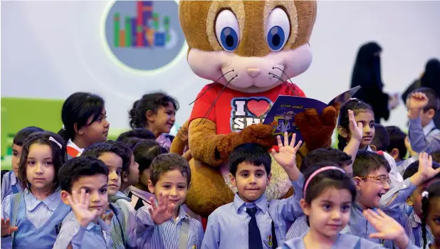  ??  ?? WE LOVE SHARJAH... Schoolchil­dren who attended the Sharjah Children’s Reading Festival 2017 at Expo Center couldn’t get enough of the event mascot, the ‘I Love Sharjah’ cartoon character.