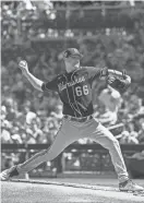  ?? TODAY SPORTS ALLAN HENRY / USA ?? Brewers starter Janson Junk threw three scoreless innings Sunday against the Cubs.