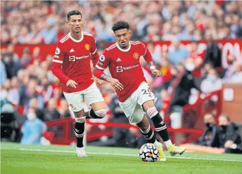  ?? REUTERS ?? Manchester United’s Jadon Sancho, right, and Cristiano Ronaldo in action during a Premier League match last month.